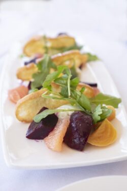 Gourmet salad of red and golden beets with Burrata cheese and arugula