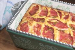 White eggplant, cheese and pancetta baked quiche with tomato garnish