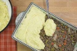 Preparation of Shepherd's Pie made with ground beef, vegetables and mashed potatoes