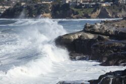 High waves cresting and hitting the coastline at La Jolla California