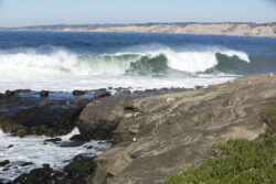 High waves cresting and hitting the coastline at La Jolla California