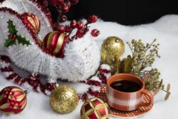 Home decor Santa and his sleigh on snow and tree decorations table setting accompanied by a warm cup of coffee